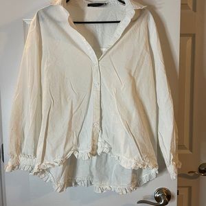 White ruffle hi low button down
